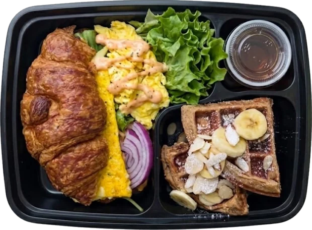 Breakfast box — croissant, chipotle scrambled eggs, banana-almond waffle — Raíz Nutrition